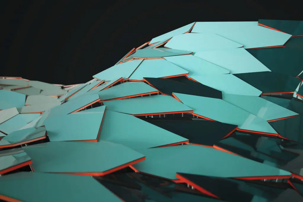 Abstract close-up of overlapping, irregular turquoise tiles with orange edges, forming a wave-like, geometric pattern against a dark background.