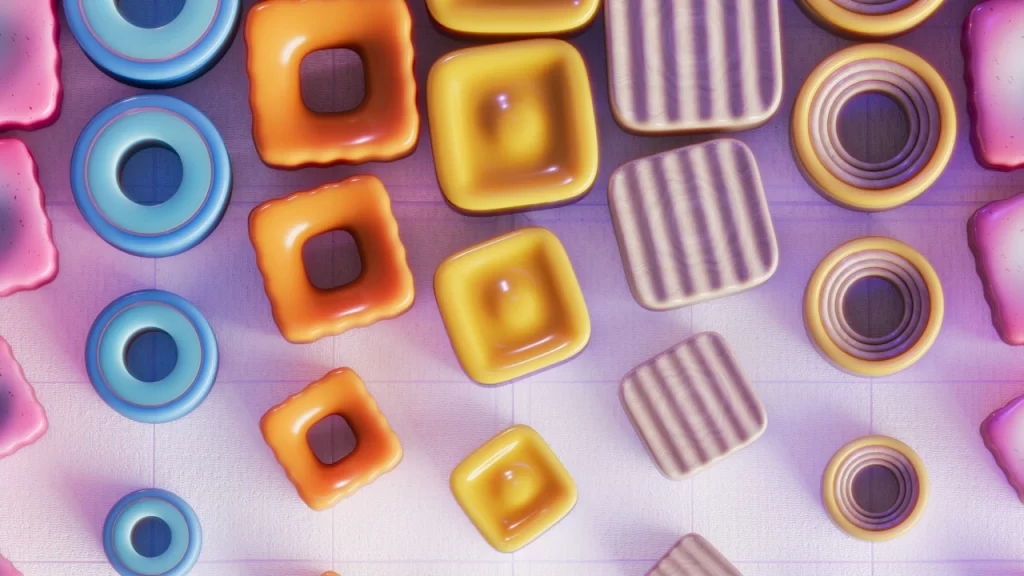 Colorful, glossy, geometric shapes—reminiscent of Parametric Architectural Design—such as squares, rings, and rectangles with various patterns are arranged on a lightly textured, pastel-colored surface with soft lighting.