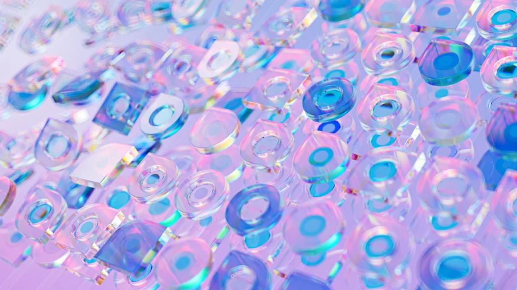 A close-up image of multiple transparent, iridescent circular and square shapes—evoking parametric architectural design—layered over each other, reflecting pastel blue, purple, and pink hues on a smooth surface.